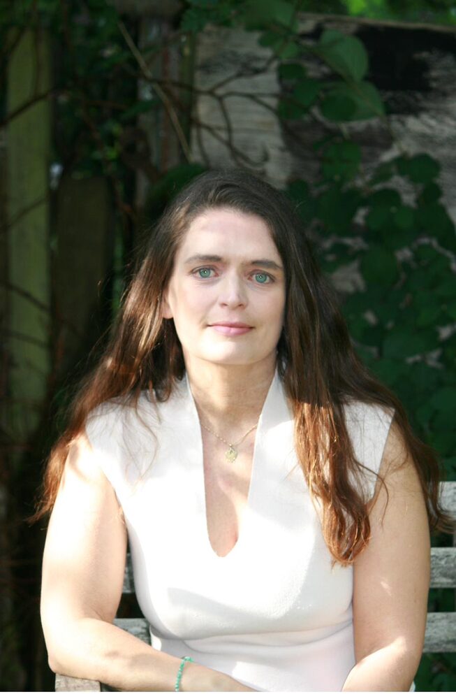Portrait of Hanna Fisher, psychotherapist and organisational consultant, in a garden setting